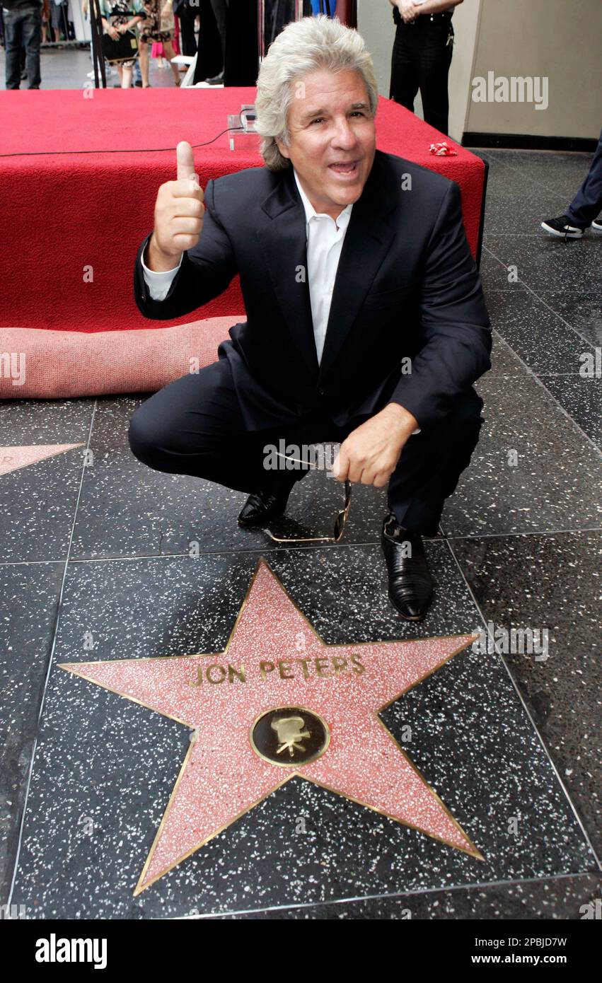 Hollywood producer Jon Peters poses with his new star on the Hollywood