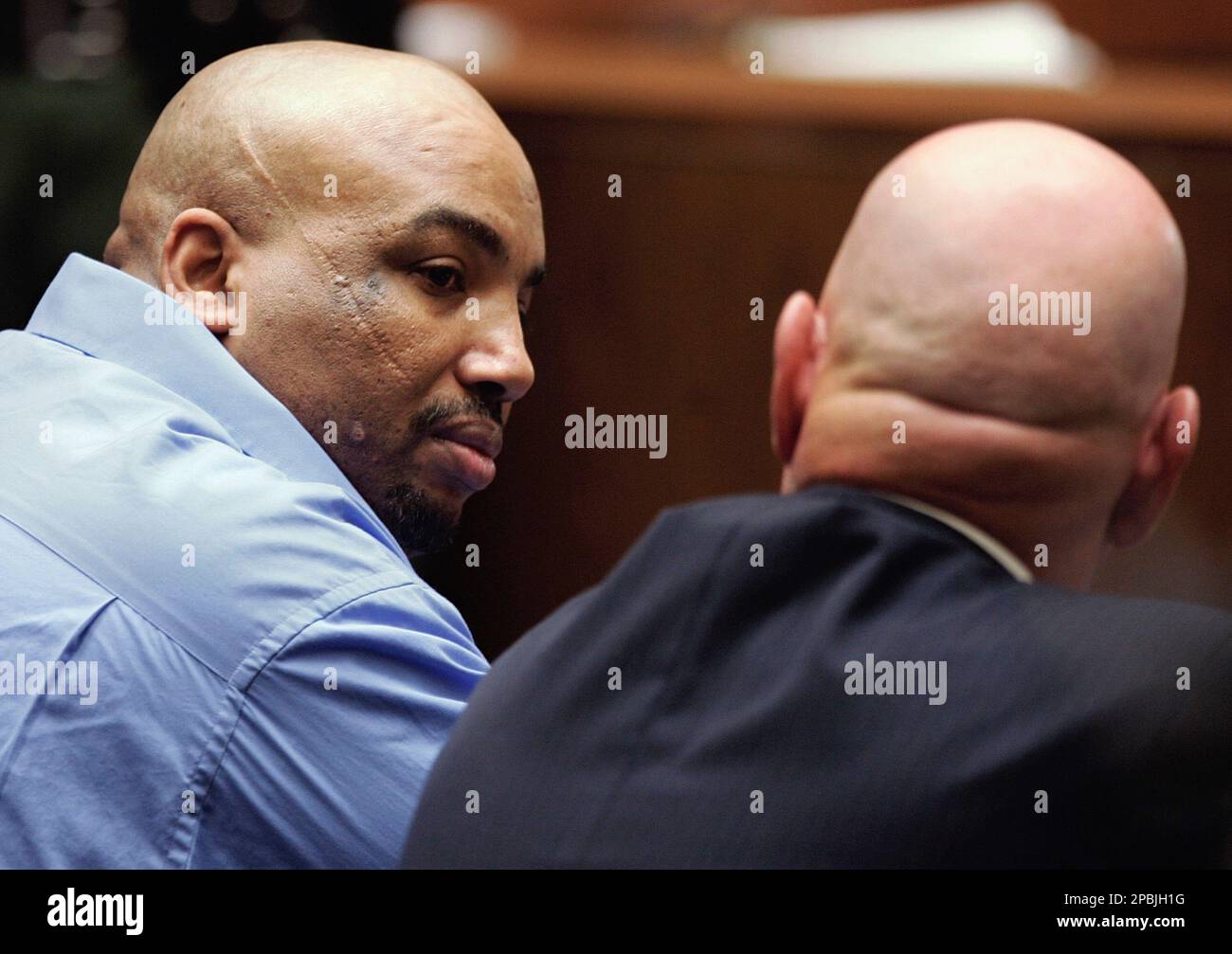 Chester Turner looks to his attorney, John Tyre, right, as a guilty