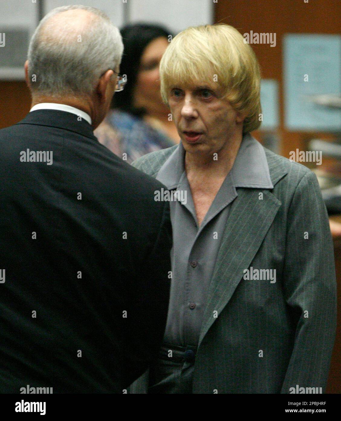 Music producer Phil Spector, right, listens to his attorney Roger Rosen ...