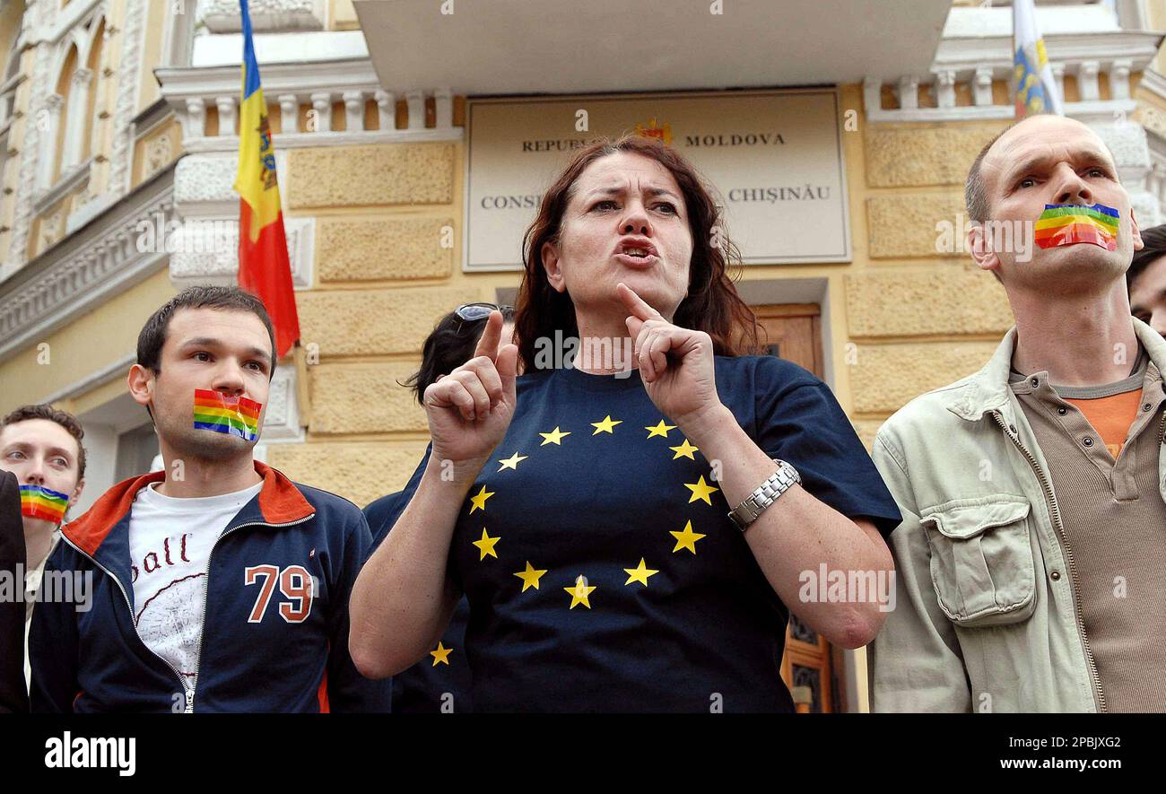 Maria Carlshamre, center, a Swedish member of the European Parliament,  gestures speaking outside the city hall of Chisinau, Moldova, Friday April  27 2007, surrounded by gay rights supporters. Dozens of gay rights