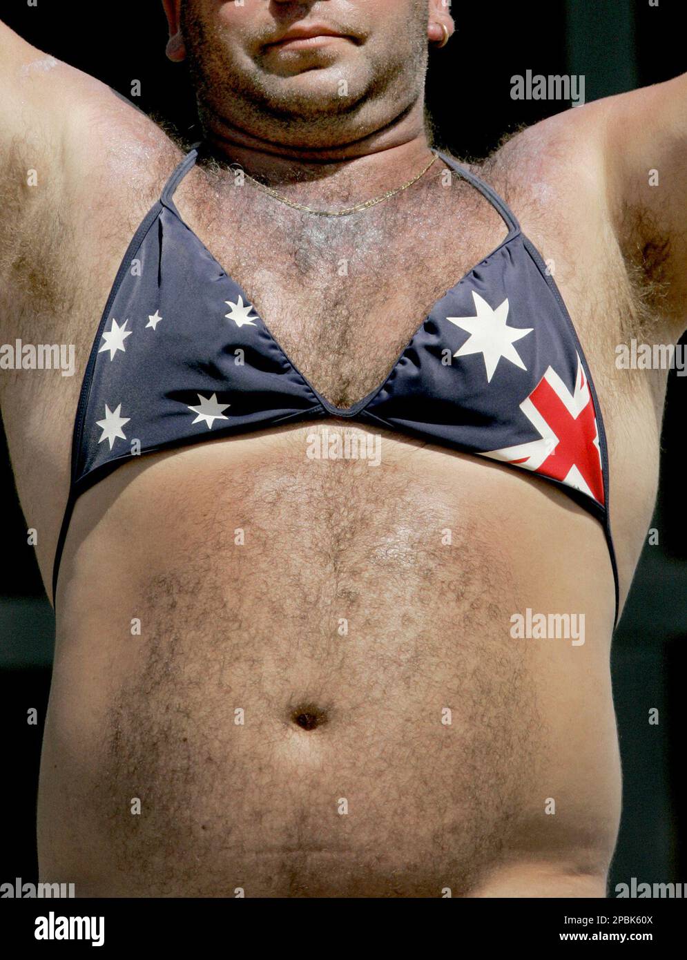 A fan wearing a bikini top with an Australian flag design is seen during  the Cricket World Cup semifinal match between Australia and South Africa at  the Beausejour Cricket Ground in Gros