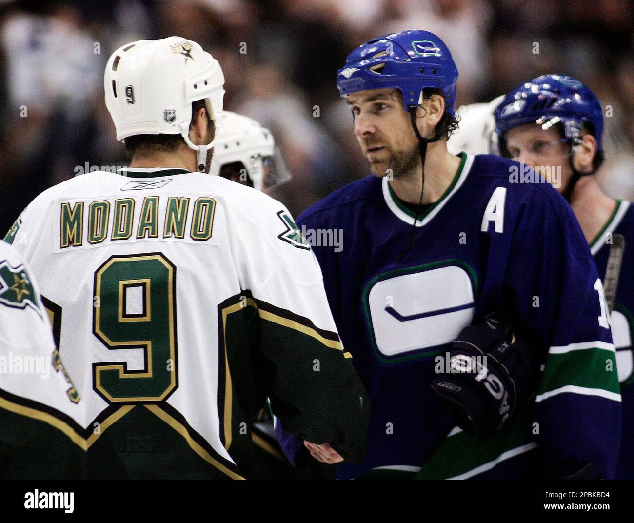 vancouver-canucks-trevor-linden-right-and-dallas-stars-mike-modano-shake-hands-after-the-canucks-defeated-the-stars-4-1-in-game-7-of-the-nhl-western-conference-quarterfinals-hockey-playoffs-in-vancouver-monday-april-23-2007-ap-photocp-richard-lam-canada-2PBKBD4.jpg
