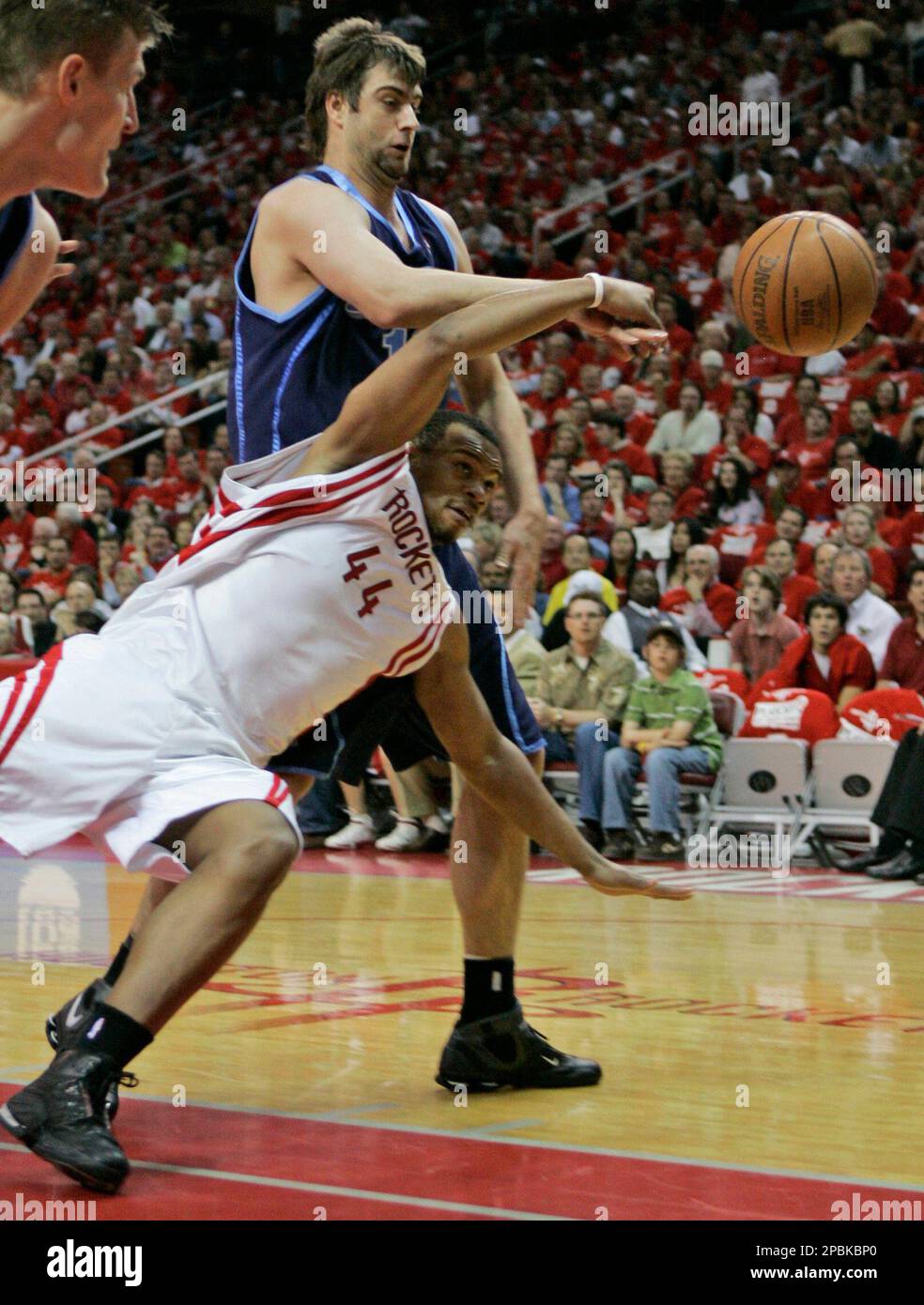 Houston Rockets' Chuck Hayes (44) falls while chasing a loose ball with ...