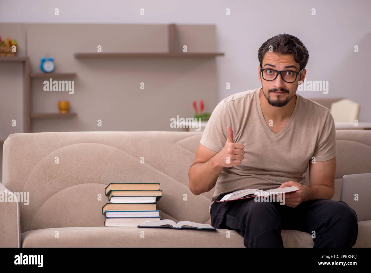 Young student studying at home during pandemic Stock Photo - Alamy