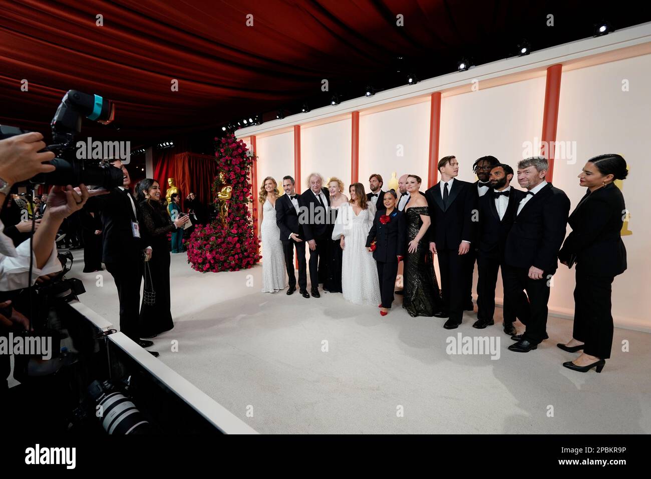 The team from "Triangle of Sadness" arrive at the Oscars on Sunday, March 12, 2023, at the Dolby