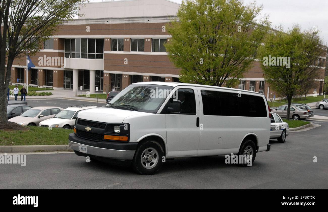 A funeral home vehicle leaves the Virginia State Medical Examiner's