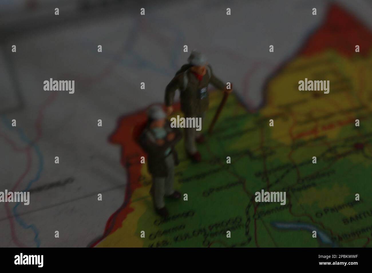 miniature figure of an explorer posing on a map or atlas Stock Photo ...