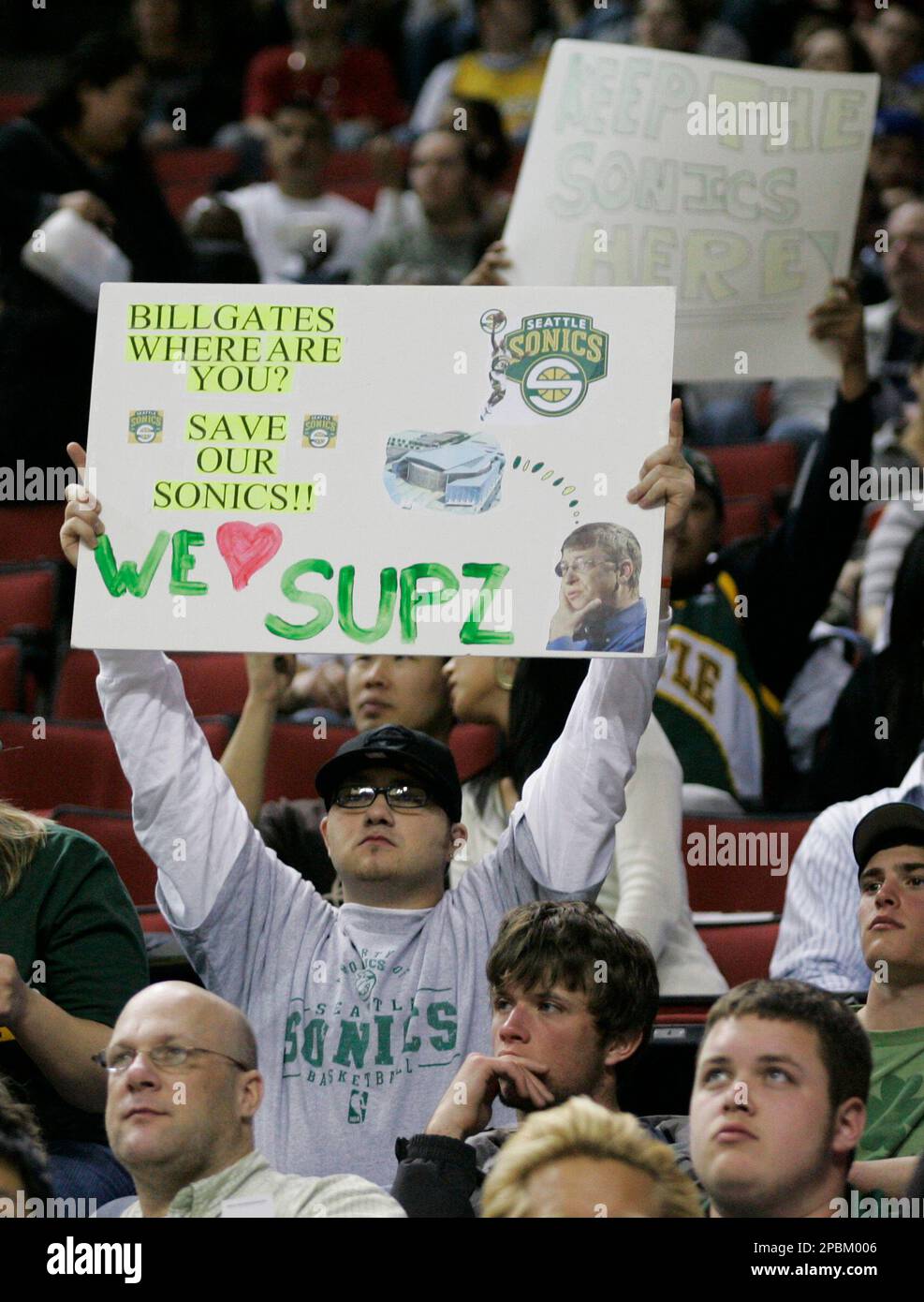 A Seattle SuperSonics fan holds a sign suggesting that Microsoft founder Bill  Gates pay for the new arena Sonics owner Clay Bennett says he needs to keep  the team in the Seattle