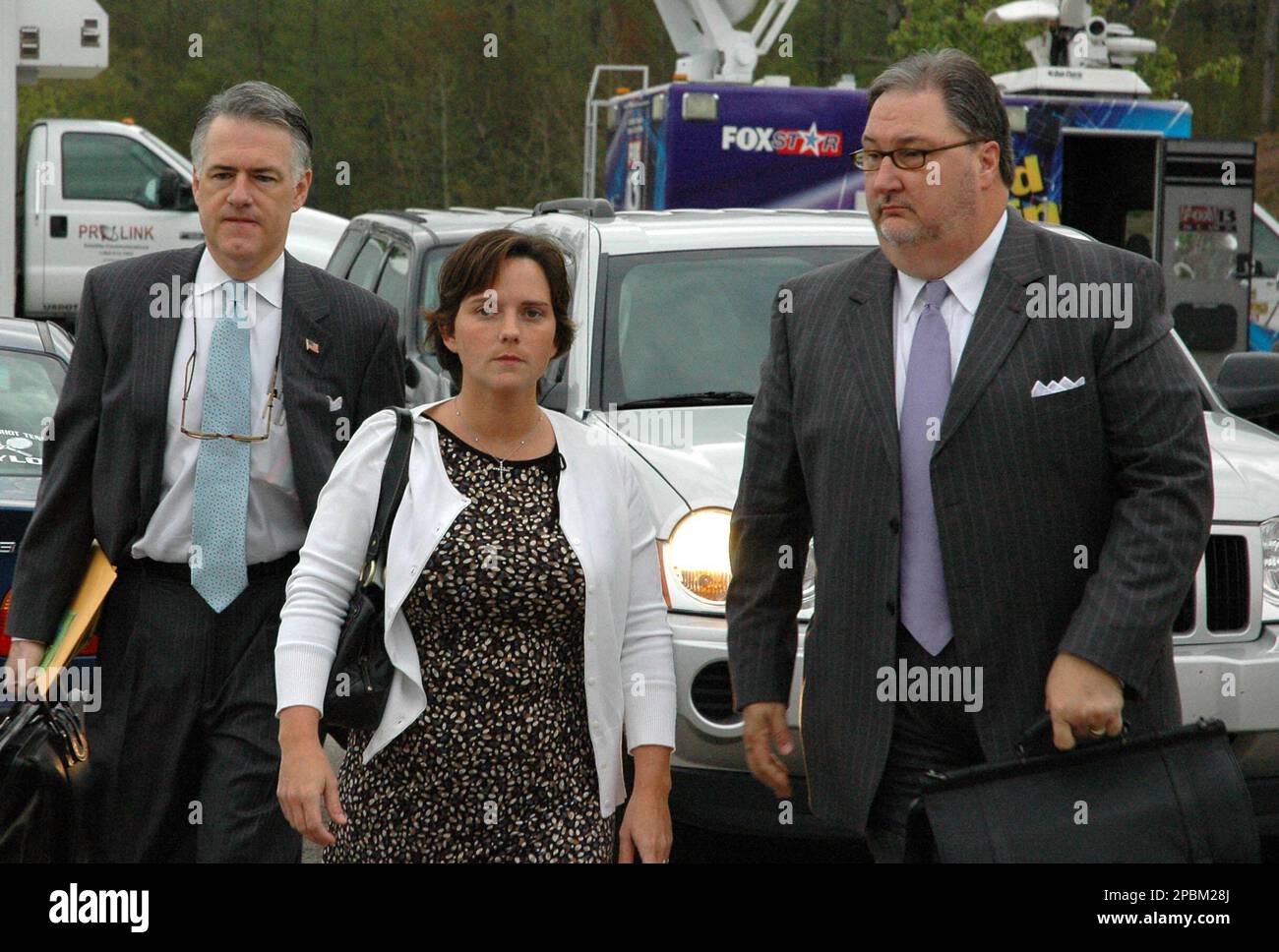 Mary Winkler, center, escorted by defense team members Tony Farese