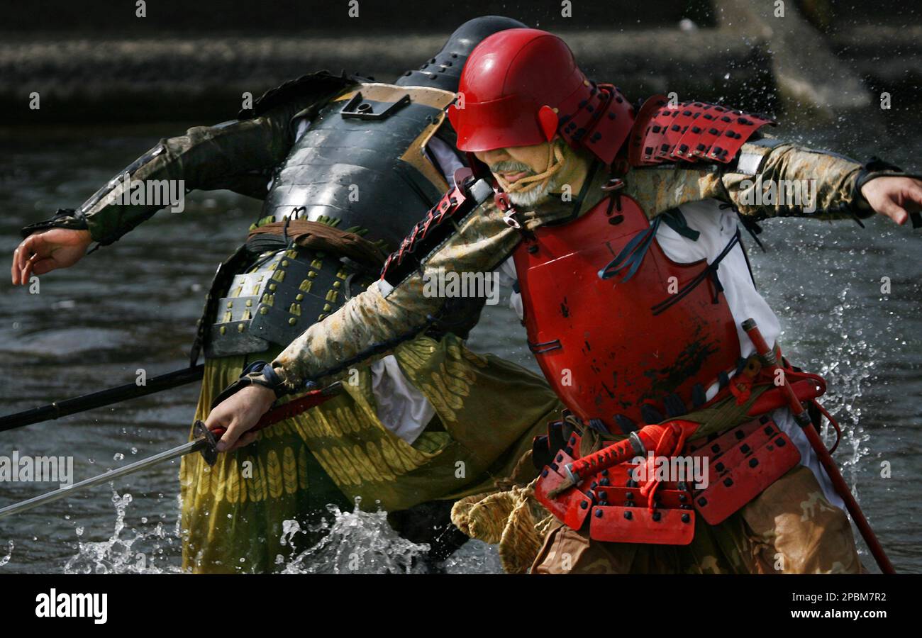 Armor-clad Samurai professional actors for sword fight demonstrate ...