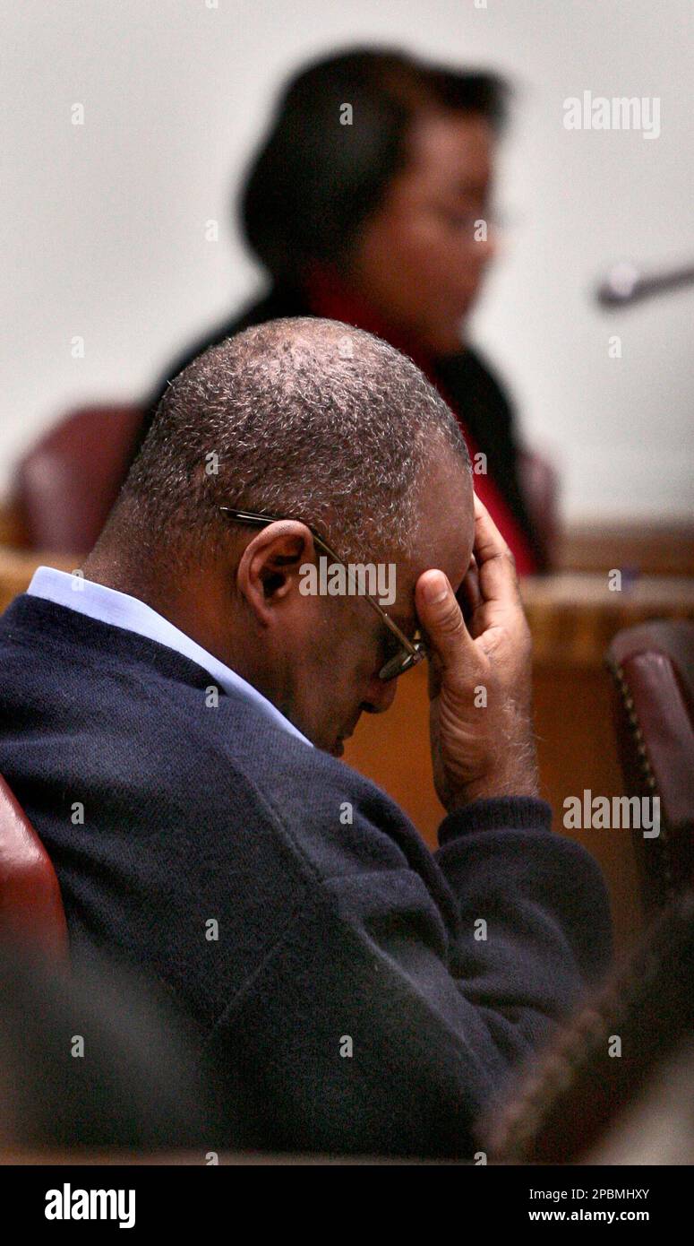 Convicted murderer Lorenzo Gilyard rubs his hand over his face Friday