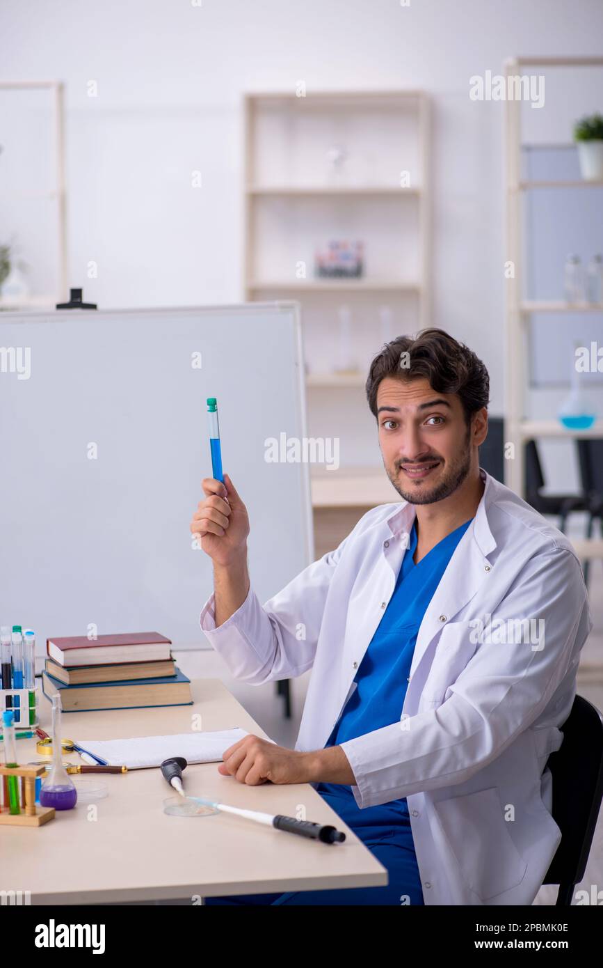 Young chemist working at the lab Stock Photo