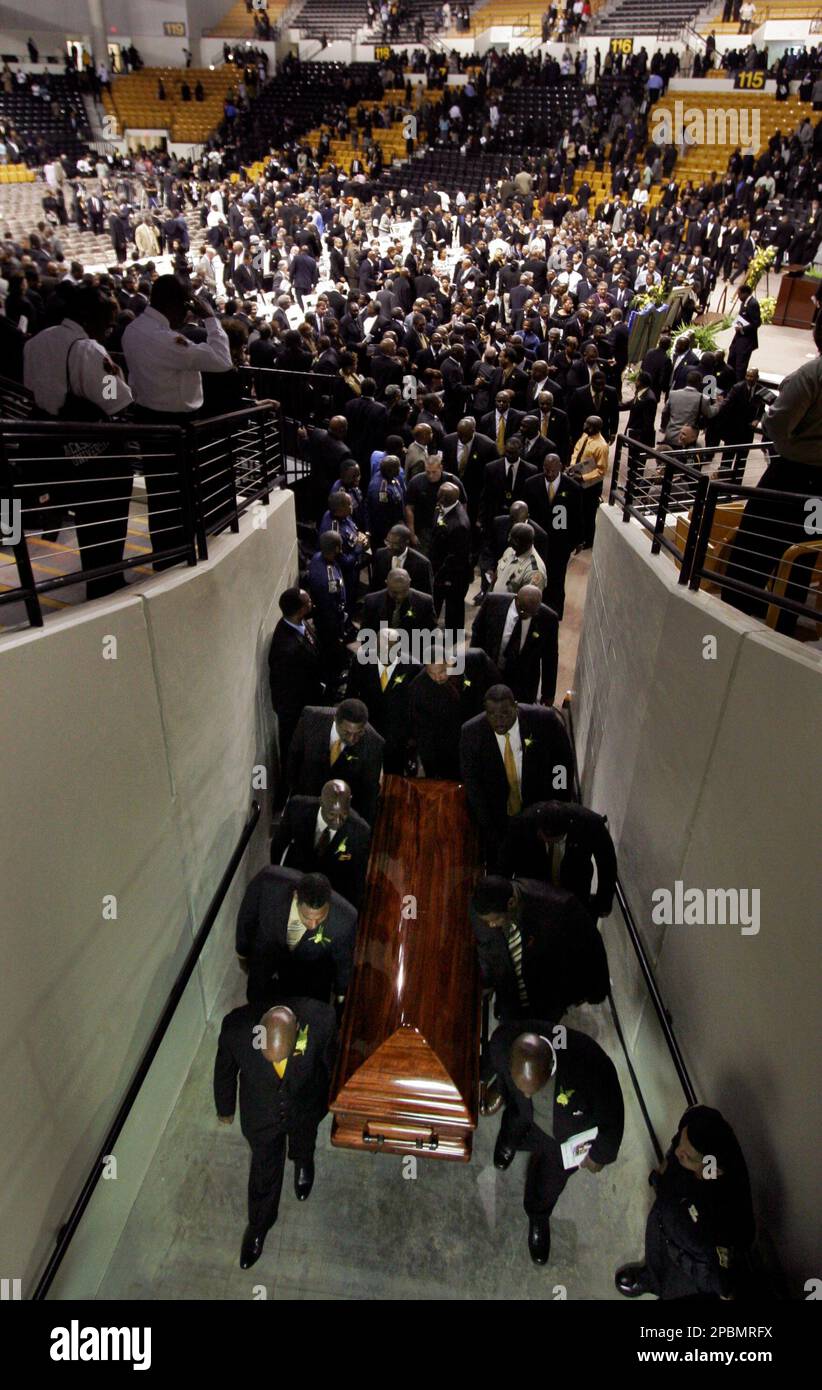 The Casket leaves the funeral for Eddie Robinson, former football coach