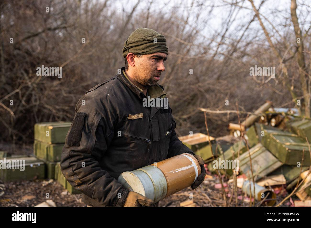 Ukraine. 07th Mar, 2023. Yehor, a member of a tank team from the 10th Separate Mountain Assault Brigade, also known as 'Edelweiss', carries ammunition to reload the tank that he operates in Donbas. Fighting has intensified in the Donbas region of Ukraine as Russian and Ukrainian forces engage in a fierce fight for the key city of Bakhmut. (Photo by Laurel Chor/SOPA Images/Sipa USA) Credit: Sipa USA/Alamy Live News Stock Photo