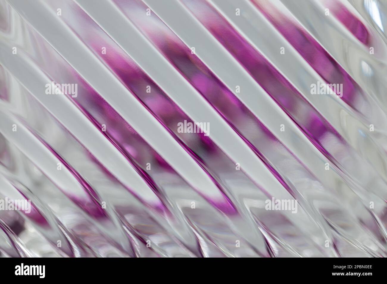 Defocused abstract macro texture background view of a beautiful modern lead crystal glass surface with shimmering diagonal lines Stock Photo