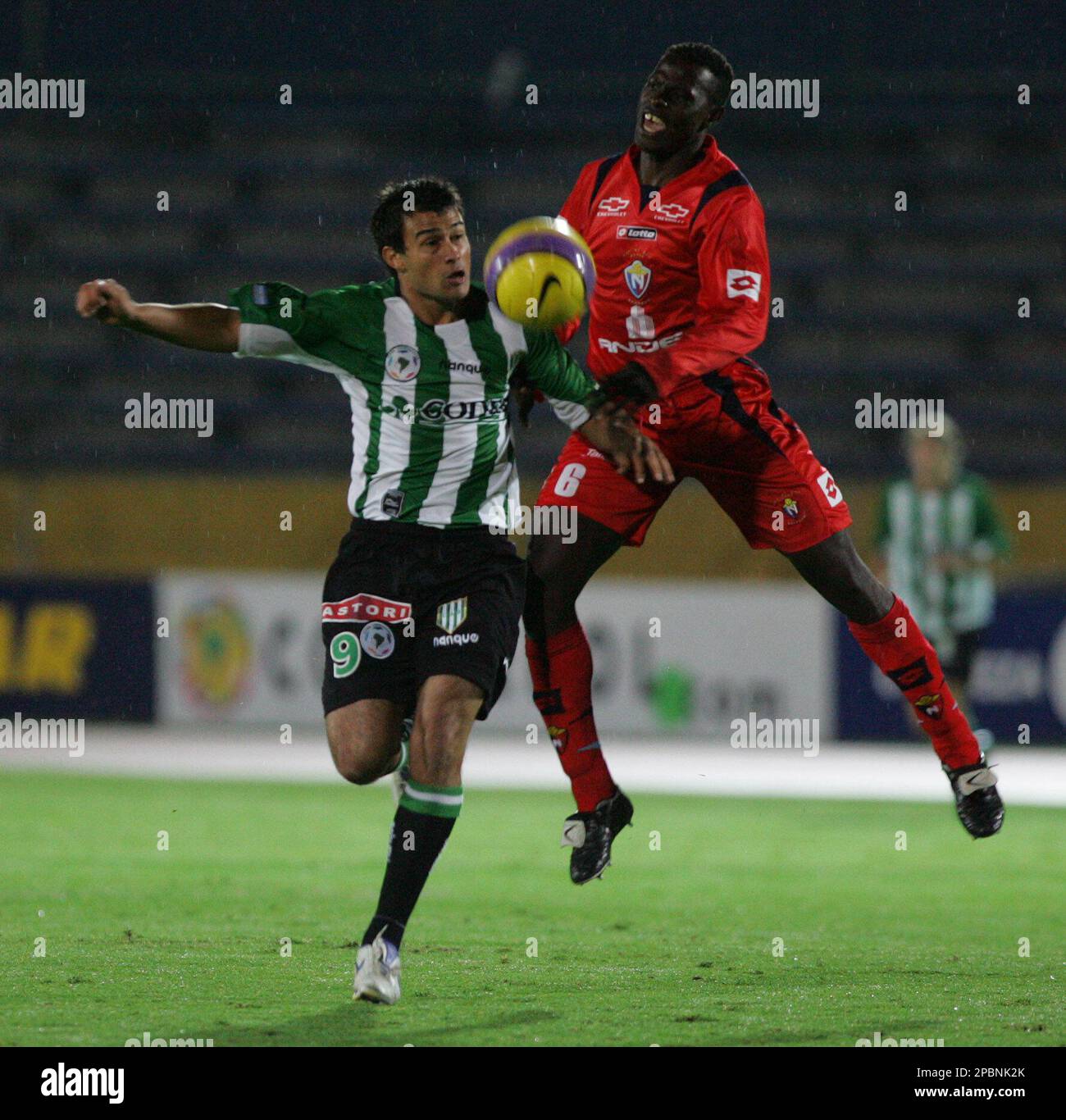 Argentina's Banfield's Dario Cvitanich, left, fights for the ball with  Mexico's America's Ricardo Rojas during a Copa Libertadores soccer game in  Buenos Aires, Wednesday, March 21, 2007. (AP Photo/ Natacha Pisarenko Stock