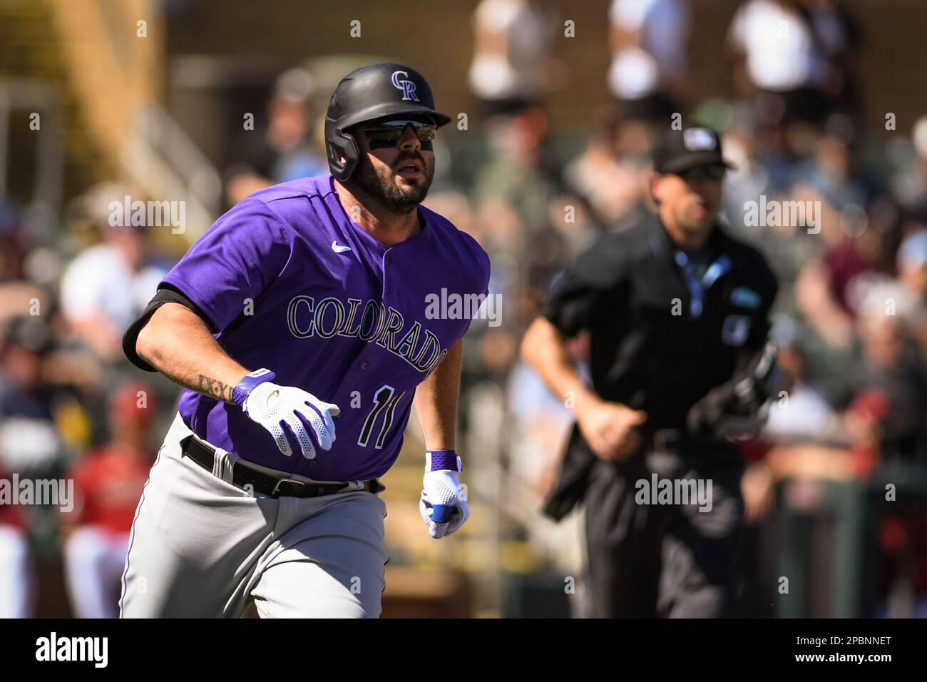 Colorado Rockies designated hitter Mike Moustakas (11) homers on a fly ball to right field in the third inning of an MLB spring training Baseball game against the Arizona Diamondbacks at Salt River Fields, Sunday, Mar. 12, 2023, in Phoenix, AZ. The Diamondbacks defeated the Rockies 10-9. (Thomas Fernandez /Image of Sport) Stock Photo