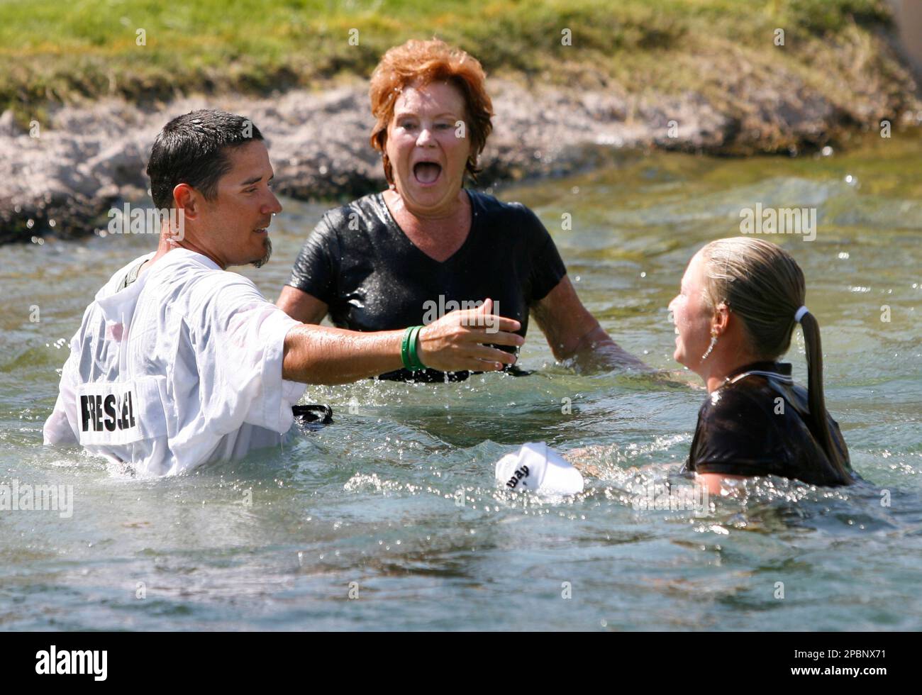Morgan Pressel, right, her grandmother Evelyn Krickstein, center, and  caddie Jon Yarbrough laugh after jumping into the pond on the 18th hole  after Pressel won the LPGA Kraft Nabisco Championship golf tournament