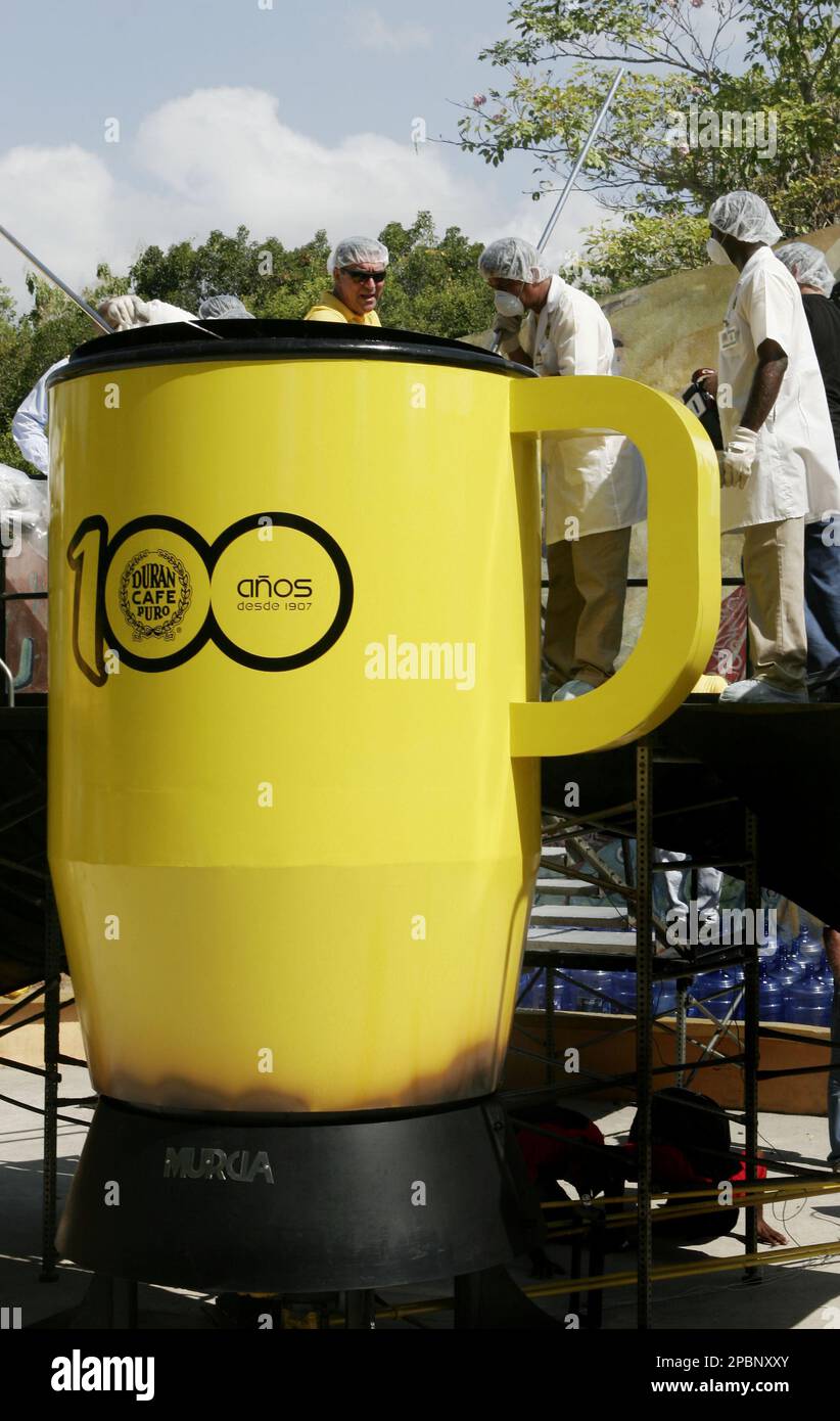 Workers stir 750 gallons of coffee in an oversized coffee mug in Panama