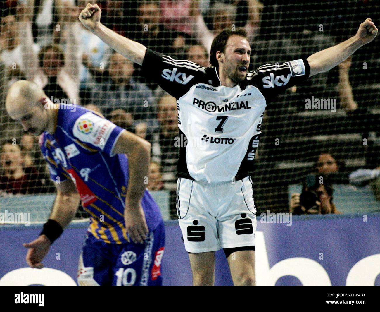 Vid Kavticnik, right, of THW Kiel celebrates as Davor Dominikovic, left