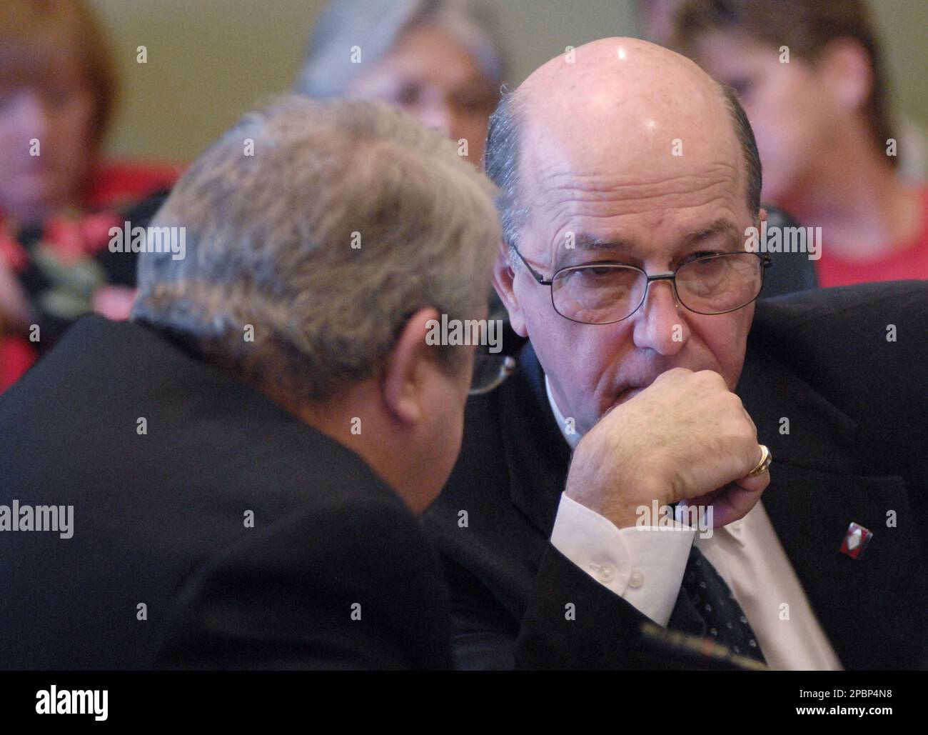Rep. Rick Saunders, D-Hot Springs, right, speaks with Sen. Jimmy