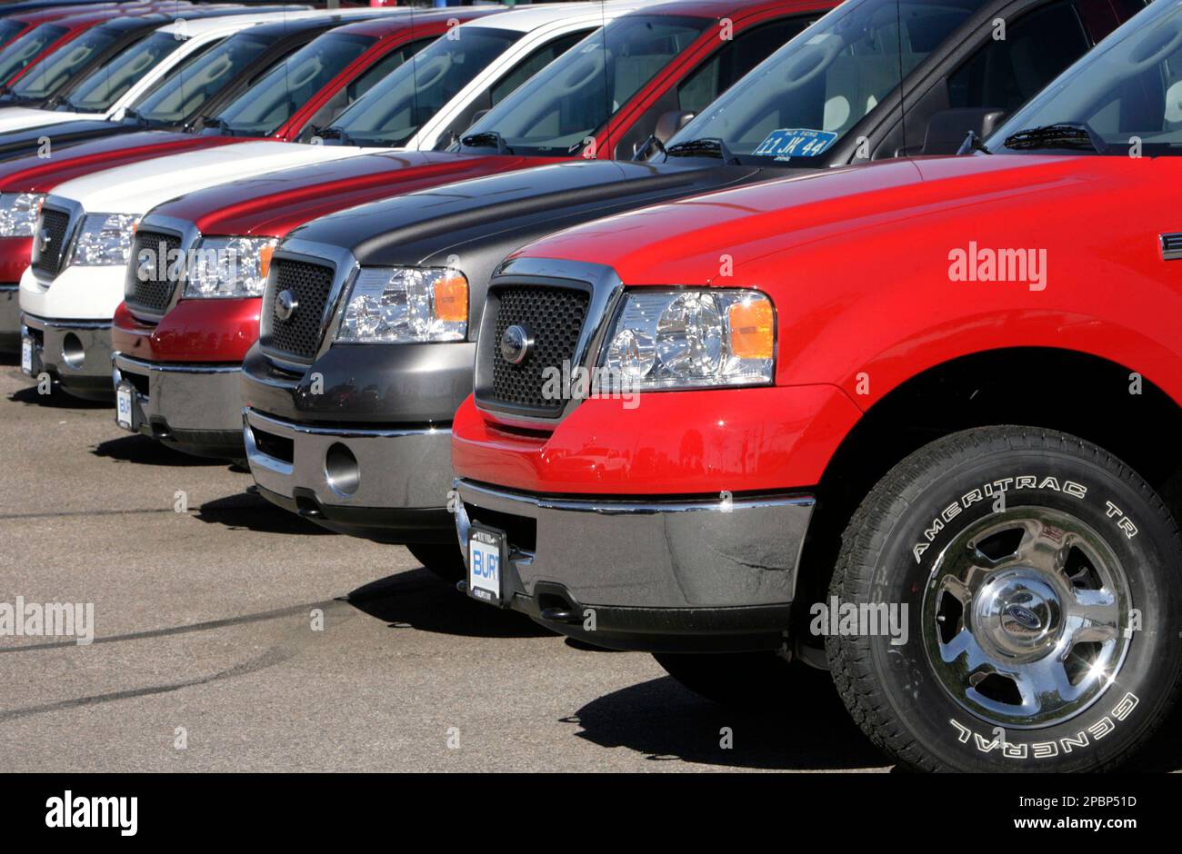 Unsold 2007 F150 pickup trucks sit at a Ford dealership in the