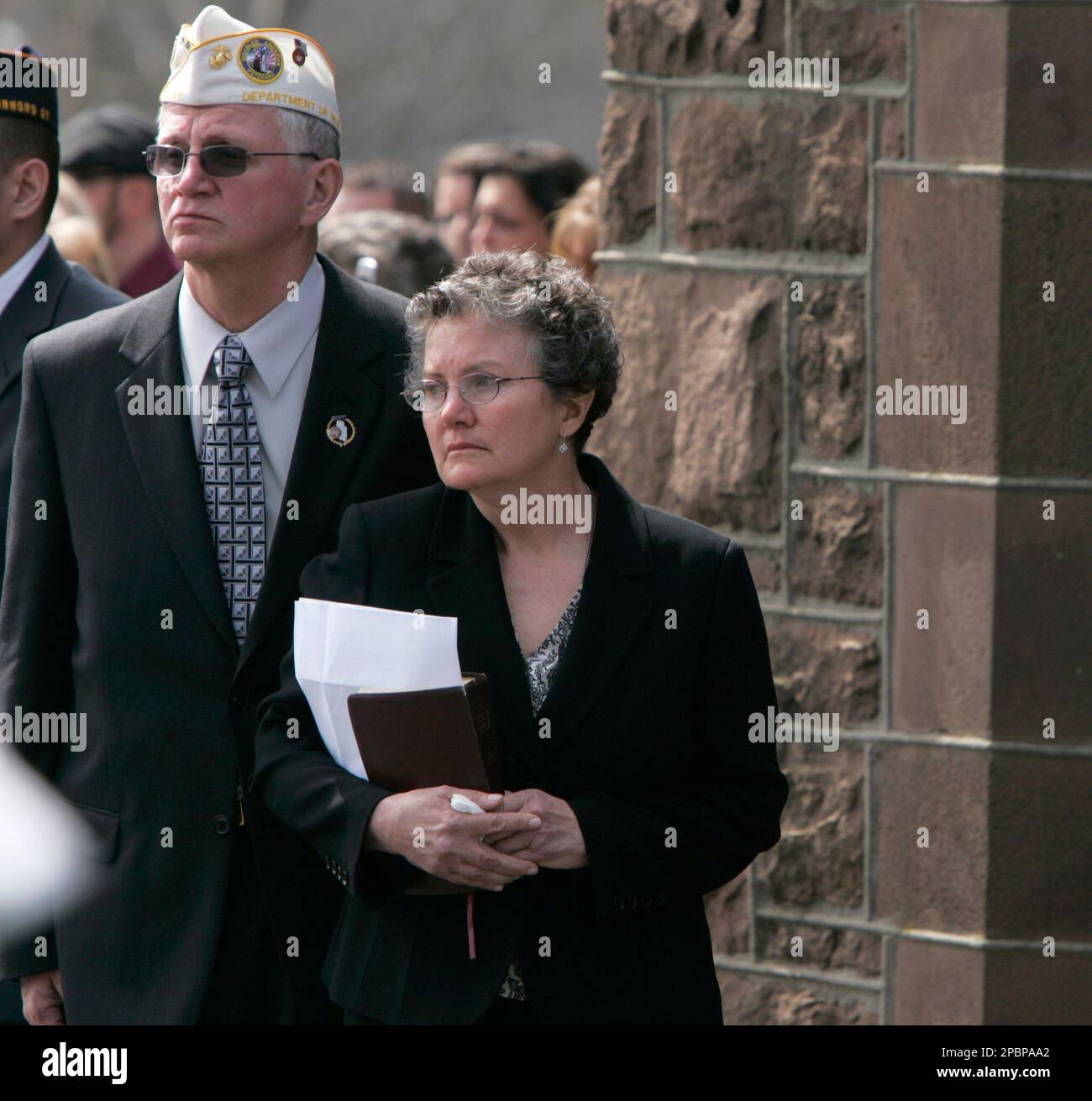 Barbara Filik Walsh, mother of Sgt. 1st Class Benjamin L. Sebban watches  with an unidentified man as a military escort carries her son's casket  outside Christ Church in South Amboy, N.J., following, image size:1300x1311