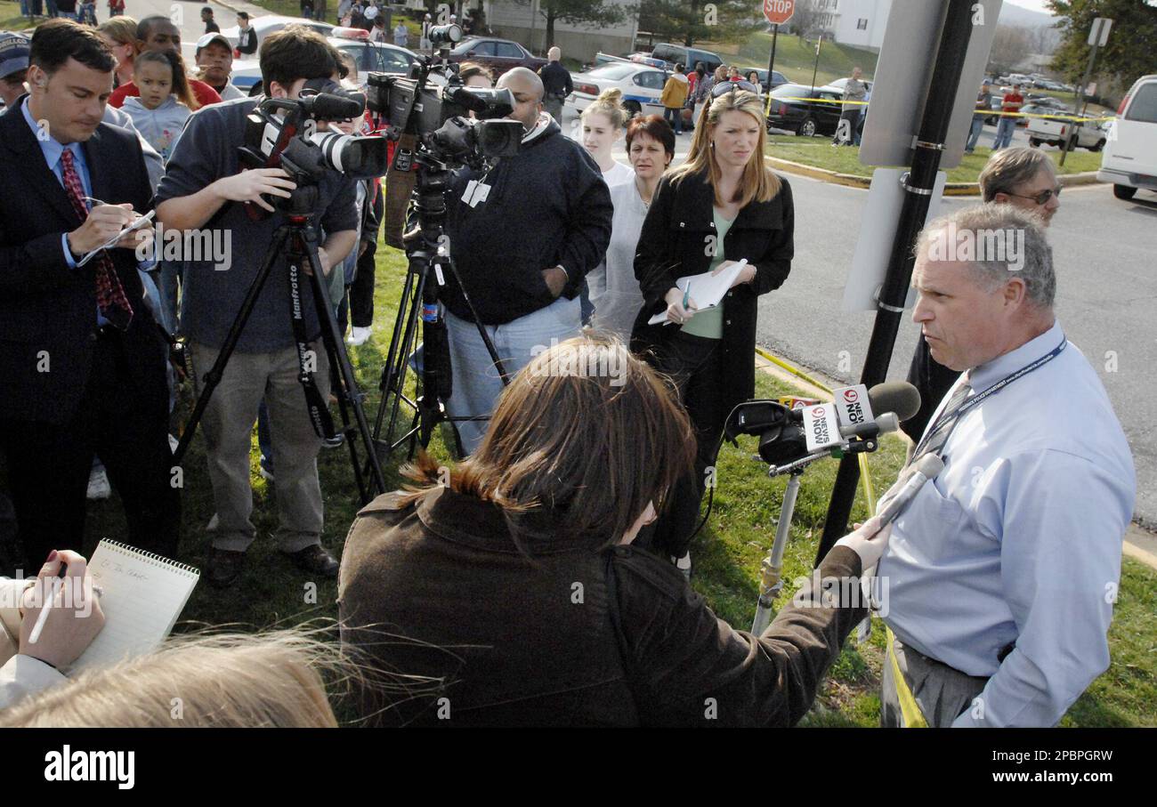 Lt. Tom Chase, right, of the Frederick Police briefs the press Monday,  March 26, 2007, in Frederick, Md., where five bodies were found. The  father, 28, was found hanging by a yellow