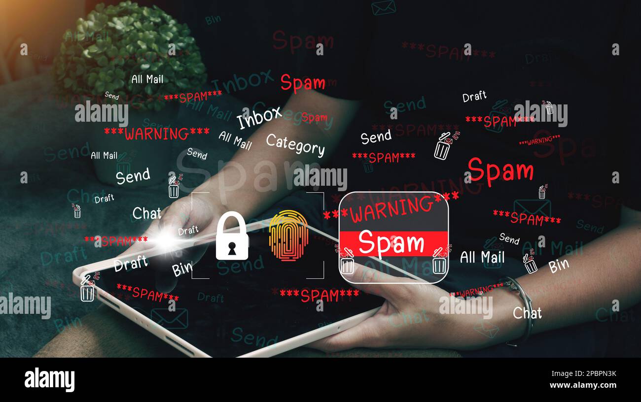 The concept of e-mail and computer viruses. Review the concepts of internet security, spam and e-marketing on screen. Spam email pop-up warnings. Stock Photo