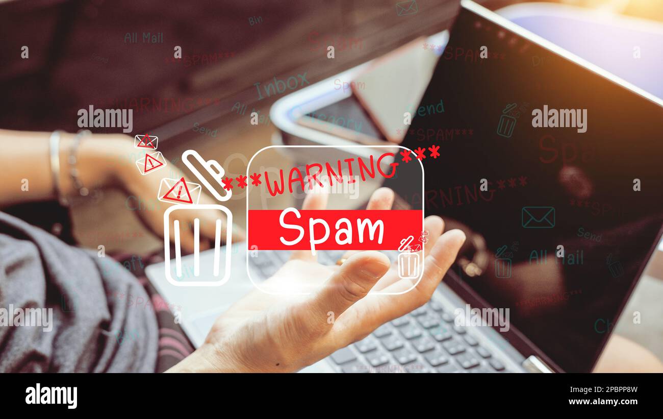 The concept of e-mail and computer viruses. Review the concepts of internet security, spam and e-marketing on screen. Spam email pop-up warnings. Stock Photo