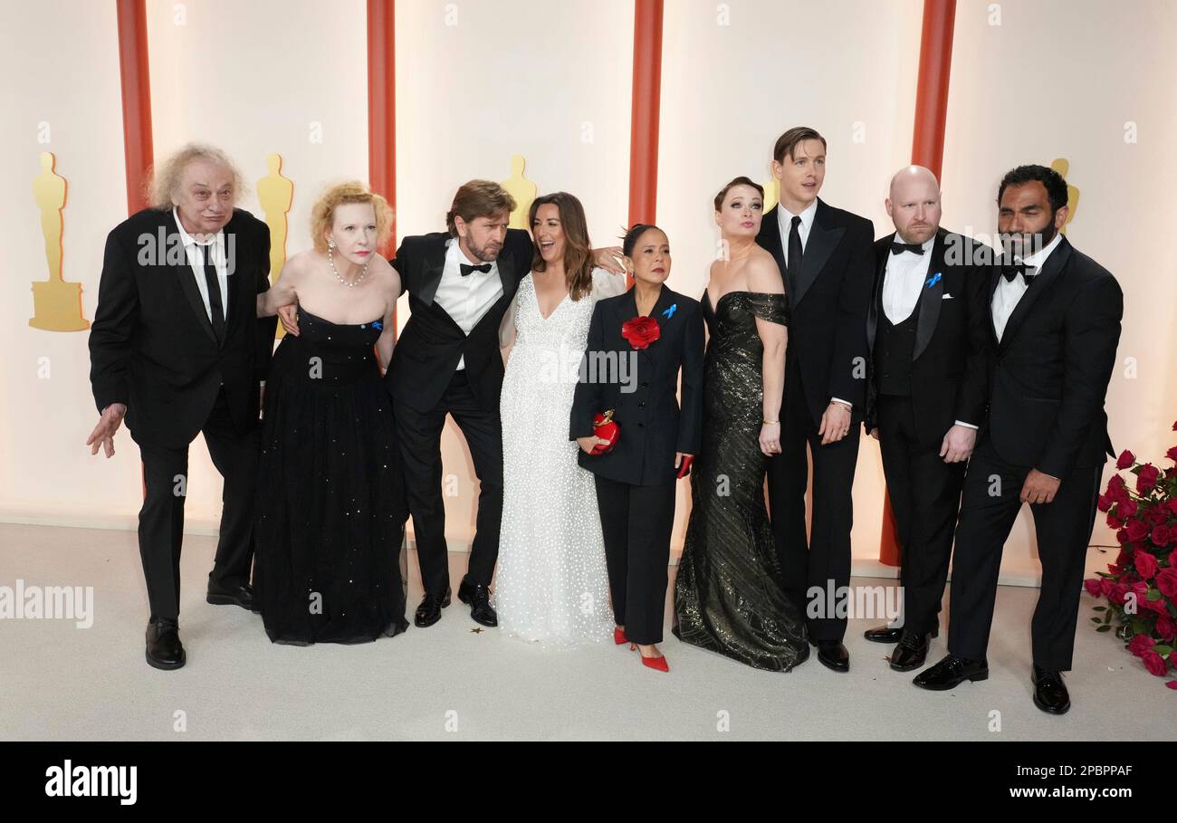 The team from "Triangle of Sadness" arrives at the Oscars on Sunday