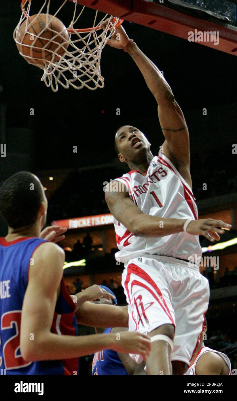 Houston Rockets' Tracy McGrady (1) dunks the ball as Chicago Bulls' Luol  Deng (9), of Sudan, and Chicago Bulls' Andres Nocioni (5), of Argentina,  watch during the first quarter of their NBA