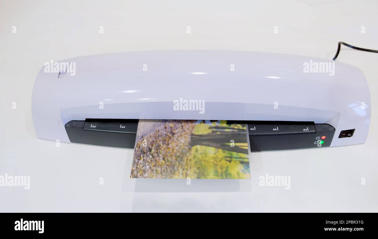 Desktop laminator hi-res stock photography and images - Alamy