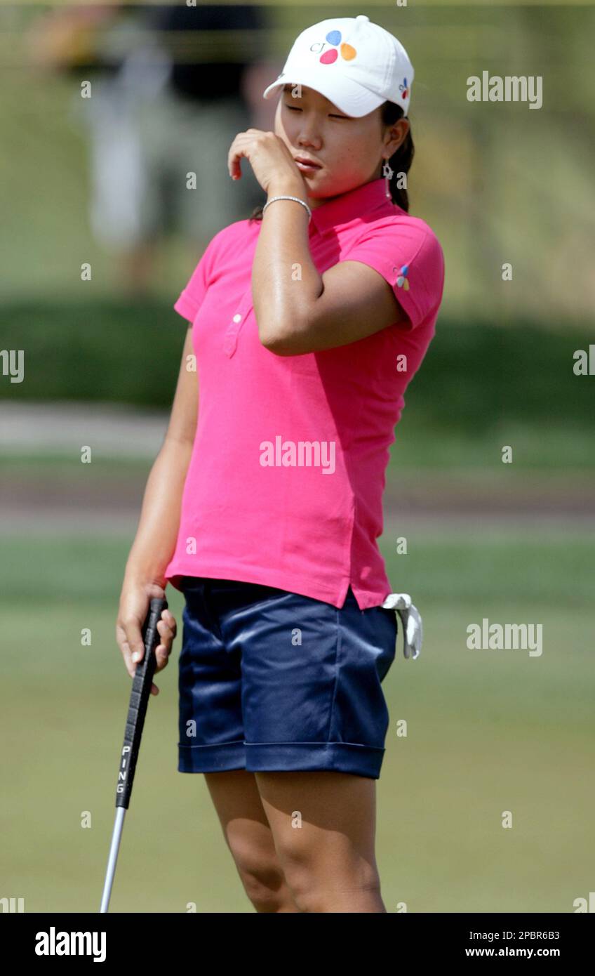 Seon Hwa Lee, of South Korea, reacts to missing a practice putt as she ...