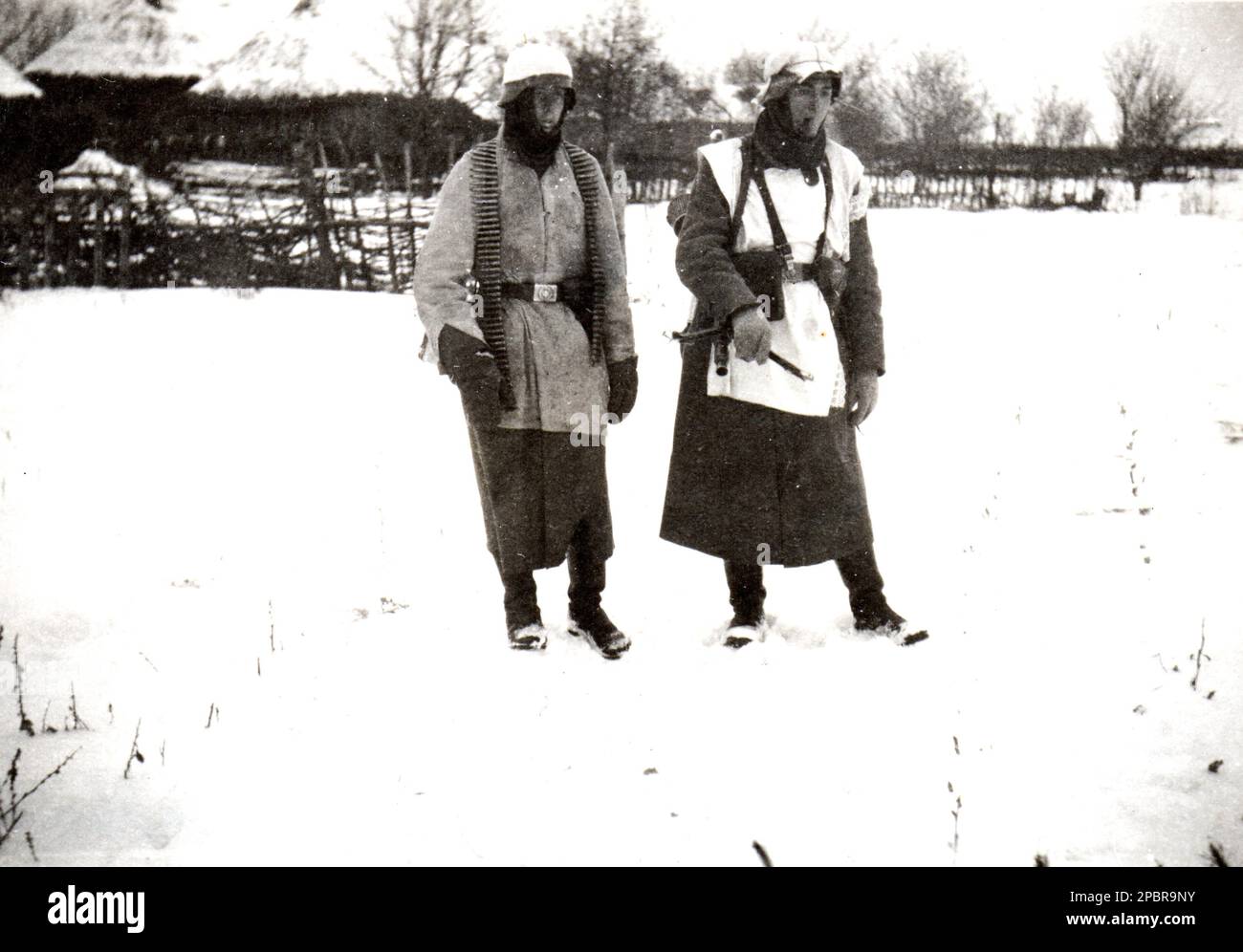 World War Two B&W photo Two German Soldiers in Winter Camo on the Russian Front 1941 . The Wehrmacht was slow to supply their troops with adequate Winter Clothing thus relying Civilian donations Stock Photo