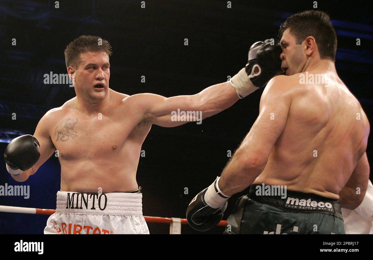 German boxer Luan Krasniqi, right, is punched by Brian Minto from the ...