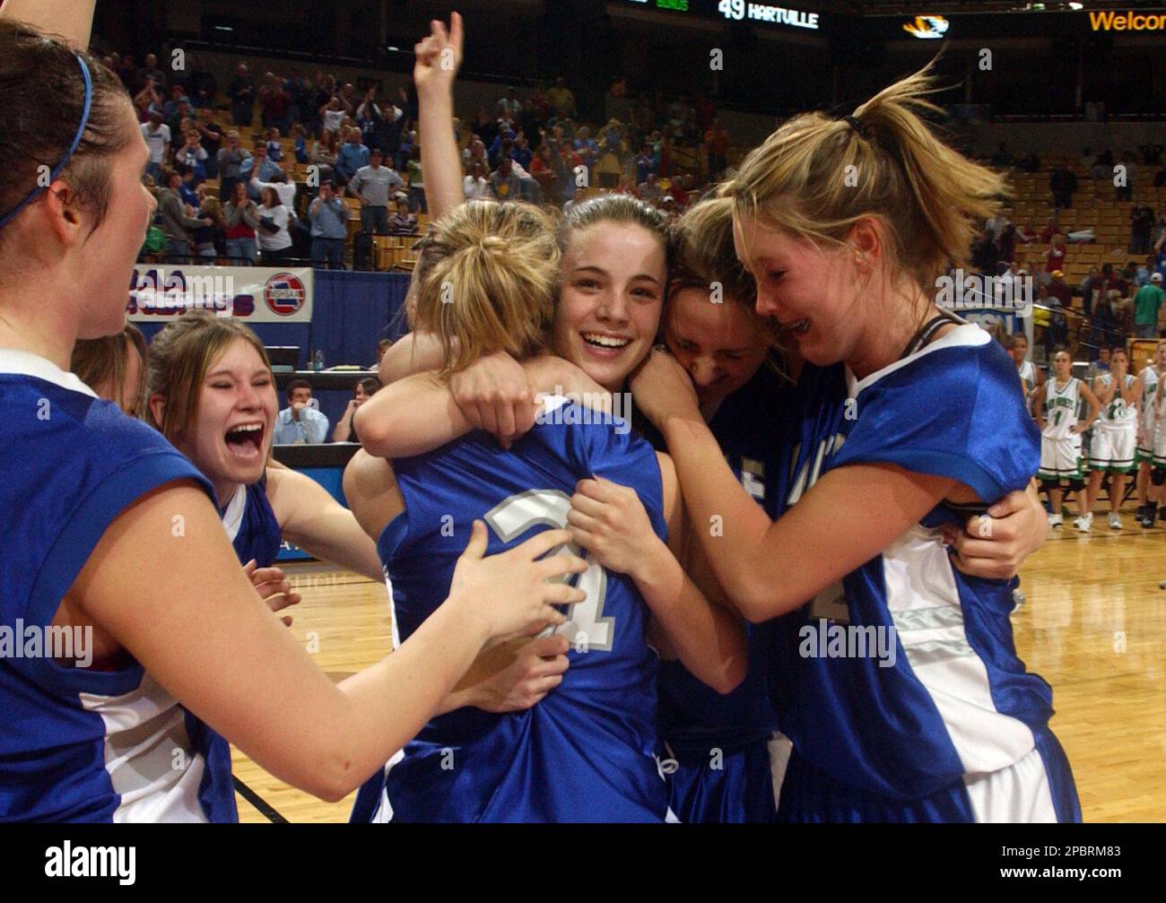 Teammates surround Hartville's Maggie Arnall, center, after she made a