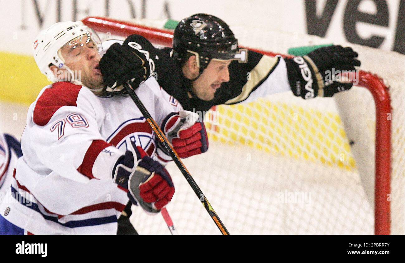 Pittsburgh Penguins' Gary Roberts, right, knocks back Montreal