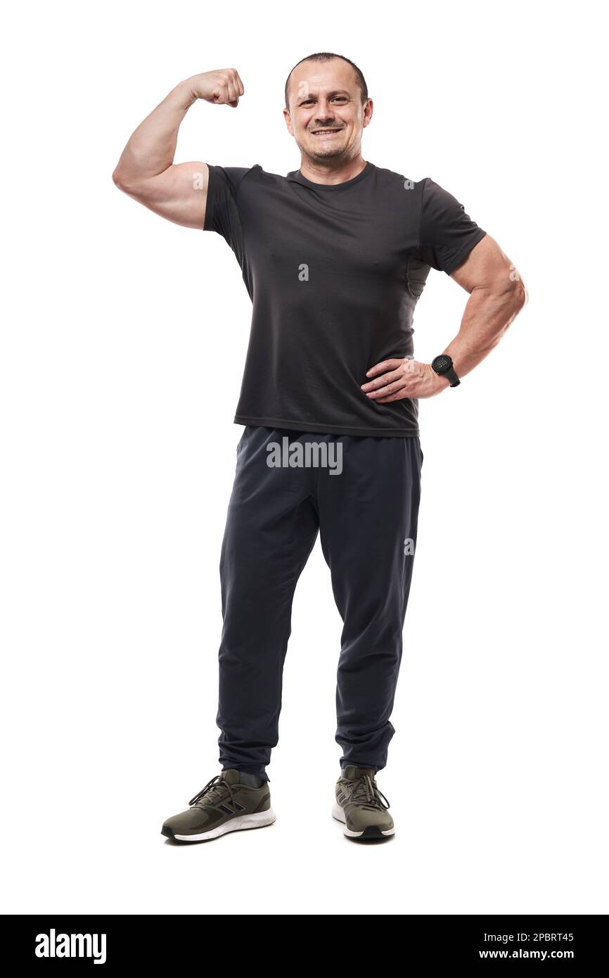 Full body of a mature fitness coach posing on white background Stock