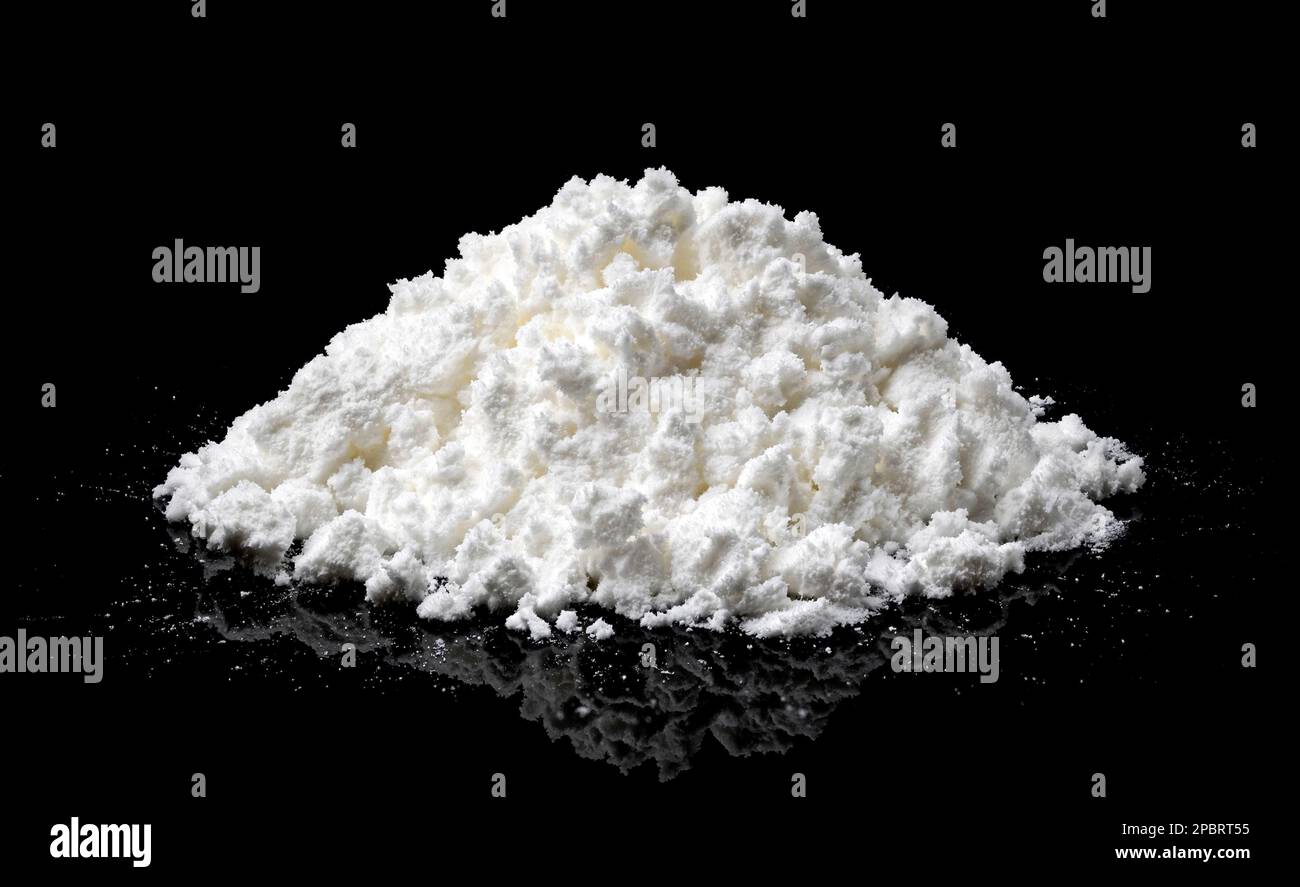 Pile of powdered milk isolated on black background Stock Photo