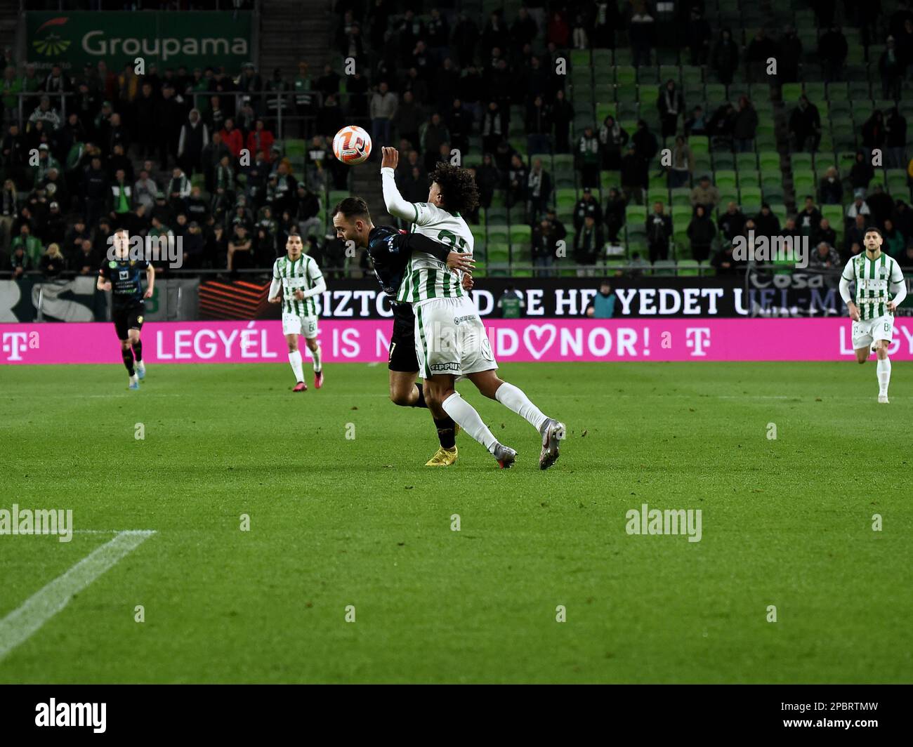 BUDAPEST, HUNGARY - MARCH 6: Claudiu Bumba of Kisvarda Master Good  challenges Henry Wingo of Ferencvarosi TC during the Hungarian OTP Bank  Liga match between Ferencvarosi TC and Kisvarda Master Good at