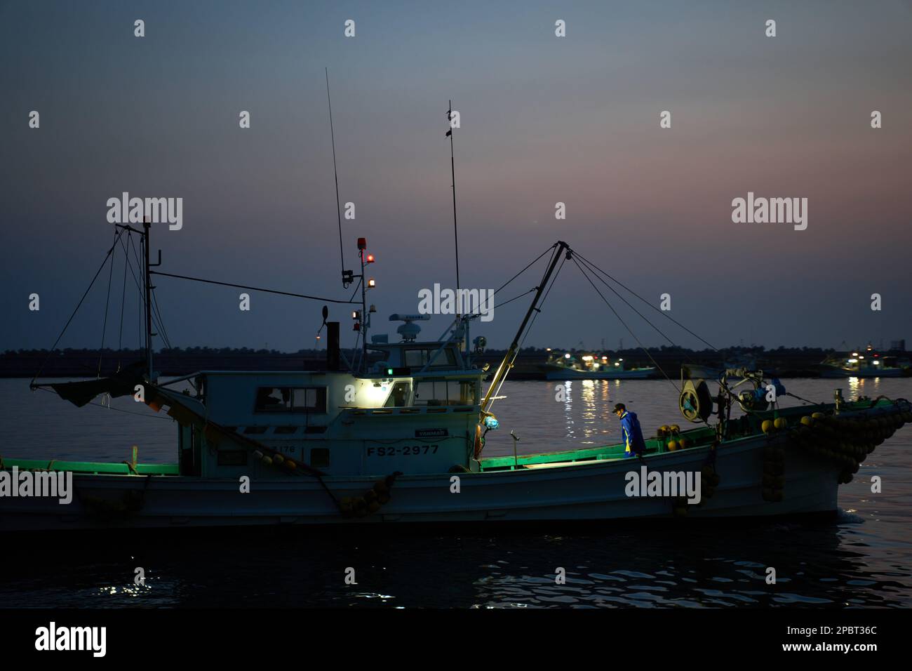 (230313) -- FUKUSHIMA, March 13, 2023 (Xinhua) -- Fishing boats are pictured approaching the shore in Soma City, Fukushima Prefecture, Japan, March 8, 2023. Struck by a magnitude-9.0 earthquake and ensuing tsunami that hit Japan's northeast on March 11, 2011, the power plant suffered core meltdowns, resulting in a level-7 nuclear accident, the highest on the International Nuclear and Radiological Event Scale. Twelve years after the 2011 accident traumatized Fukushima's fishing industry, local fishermen are still struggling for recovery. As Japan pushes ahead with dumping tons of contaminate Stock Photo
