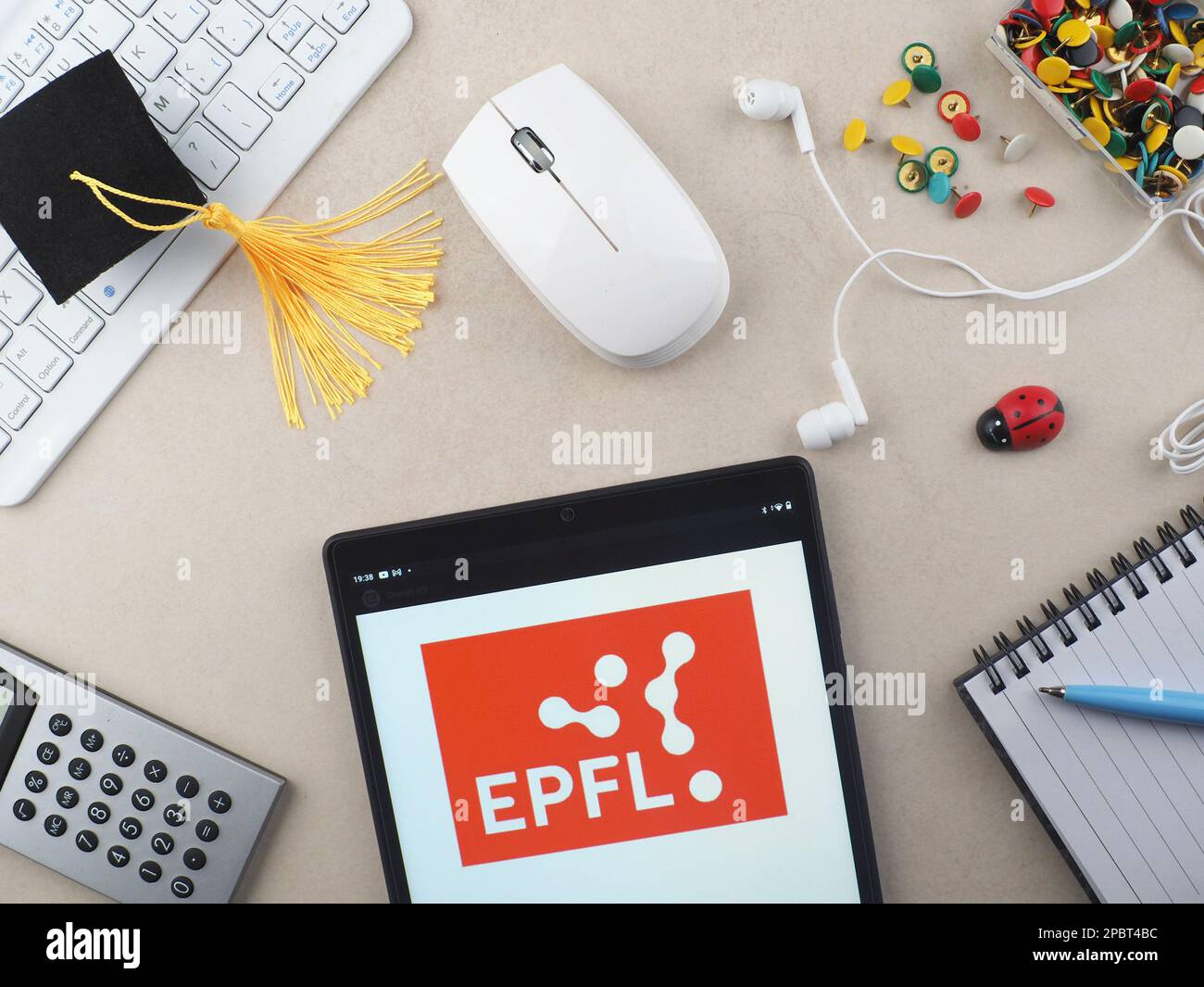In this photo illustration, Ecole Polytechnique Federale de Lausanne EPFL  logo seen displayed on a tablet. Stock Photo