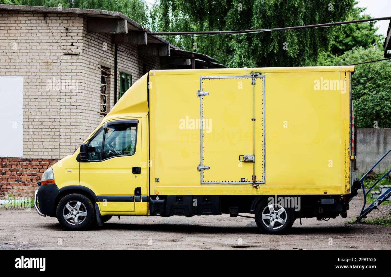 Yellow Driving van. delivery car. Transportation service Stock Photo