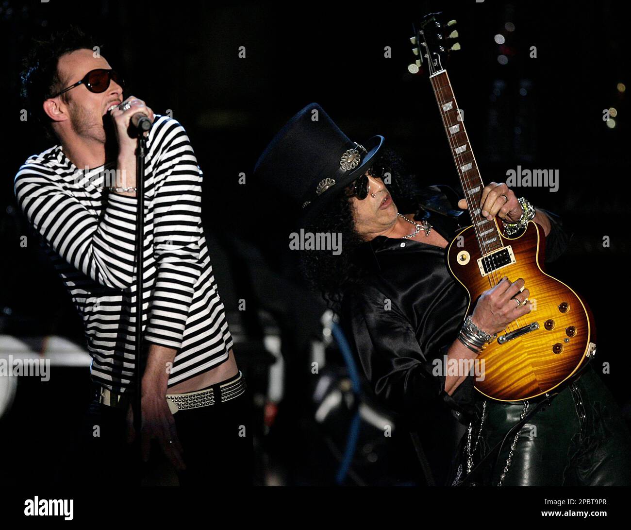 Scott Welland, left, and Slash from the band Velvet Revolver perform on