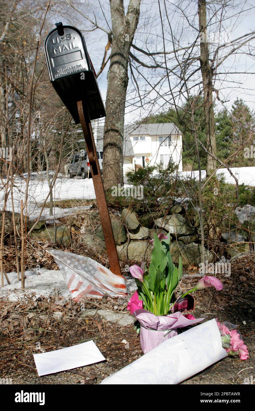 Flowers are seen in front of the home of Brad Delp, lead singer of the