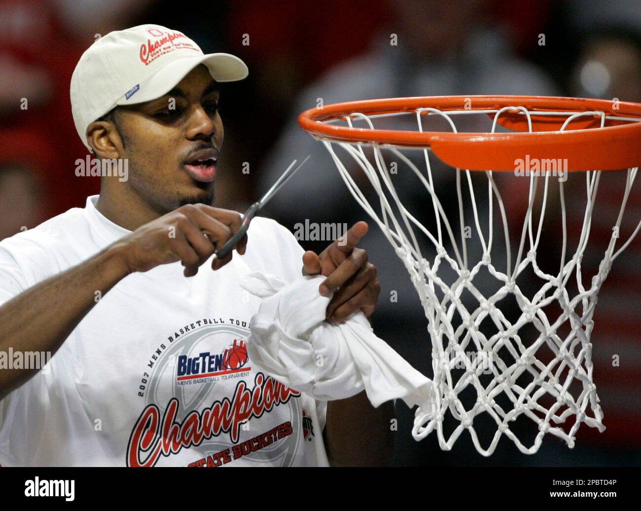 Ohio State guard Ron Lewis cuts off a piece of the net following their ...