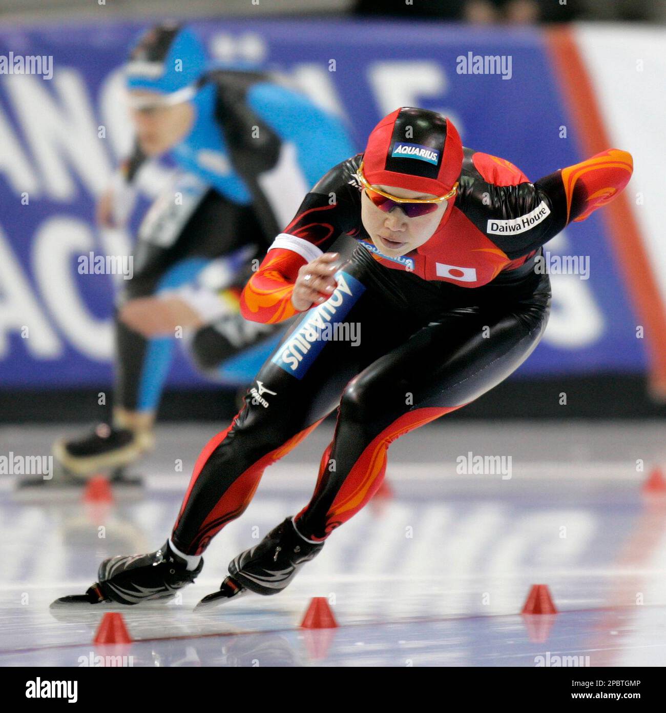 Japan’s Sayuri Osuga leads Germany’s Jenny Wolf during the first race