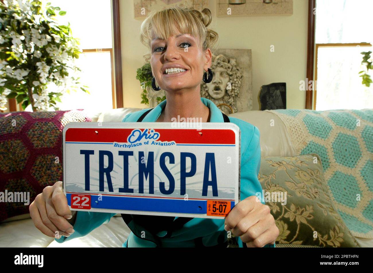 Marla Hayes shows off the vanity license plate she got to put on