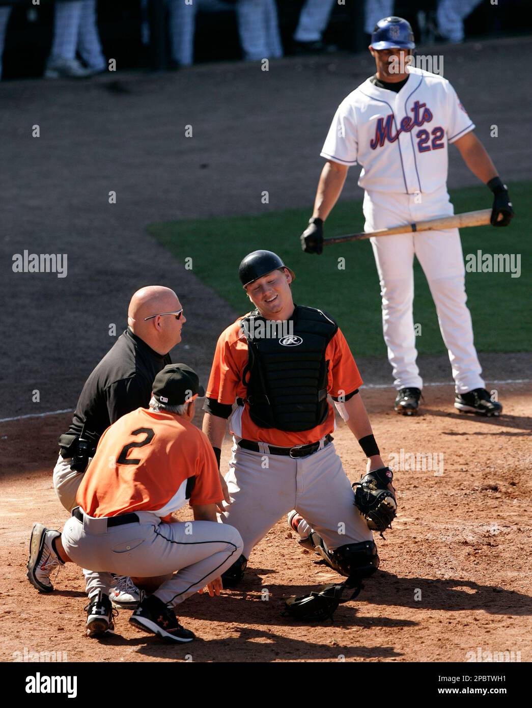 Baltimore Orioles catcher Adam Donachie talks with manager Sam Perlozzo ...